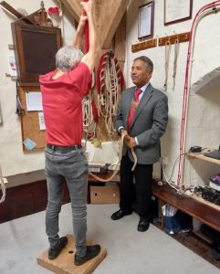 The deputy mayor of Winchester having a go at learning to ring a tower bell