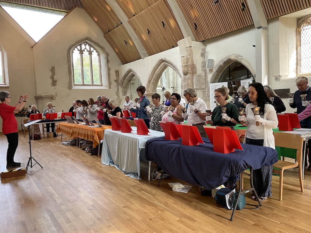 Ringing handbells in Ropley church